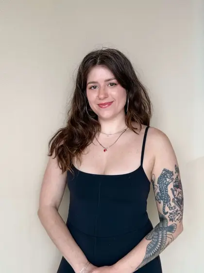 Kelsey Brochu, Pilates instructor at Revival Pilates Studio, guiding clients in strength and mindful movement.