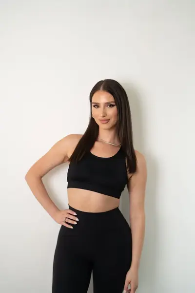 Sariah Khalil, certified Pilates instructor at Revival Pilates Studio, teaching Pilates with a focus on posture, core strength, and flexibility.