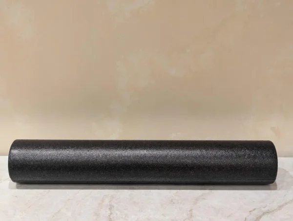 Black foam roller for muscle recovery and flexibility